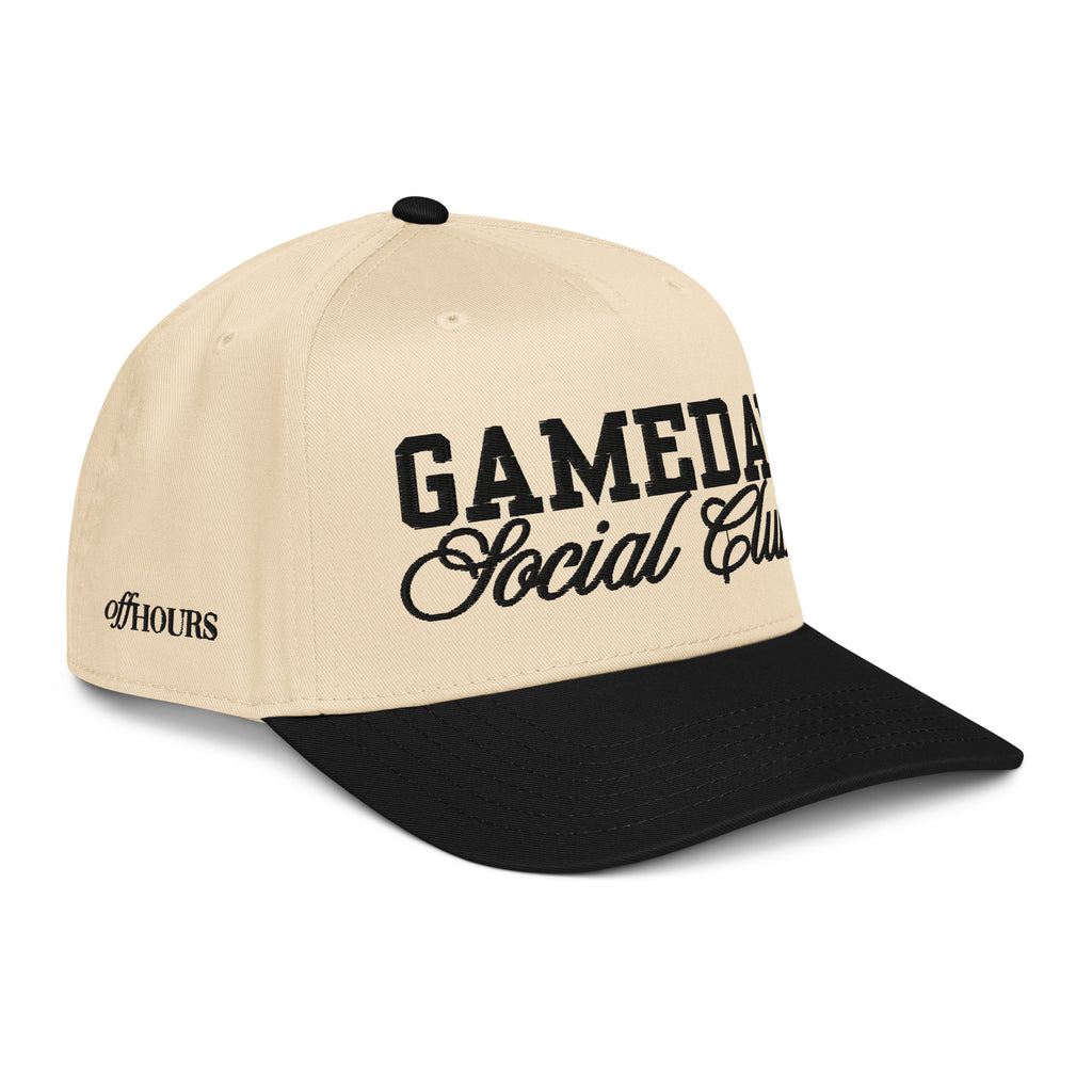 Angled view of Gameday Social Club black and natural trucker hat by Off Hours