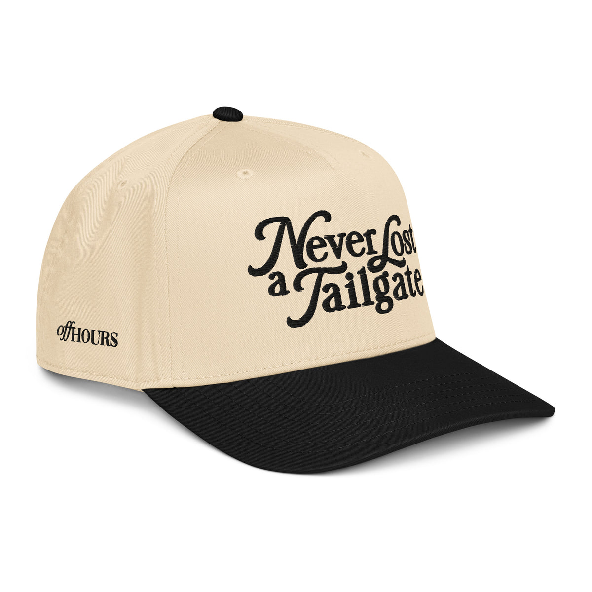 Angled view of Never Lost a Tailgate black and natural trucker hat by Off Hours