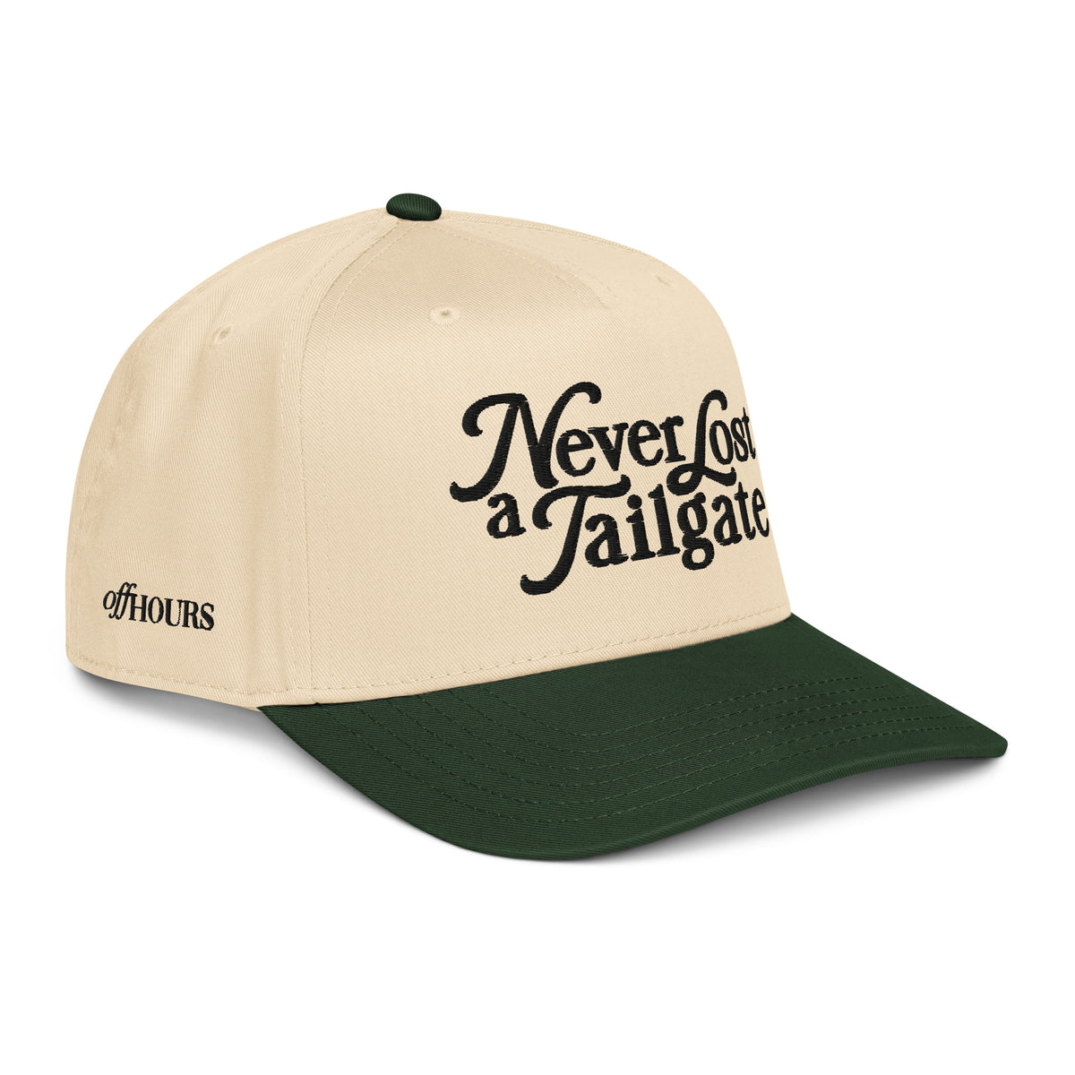Angled view of Never Lost a Tailgate green and natural trucker hat by Off Hours