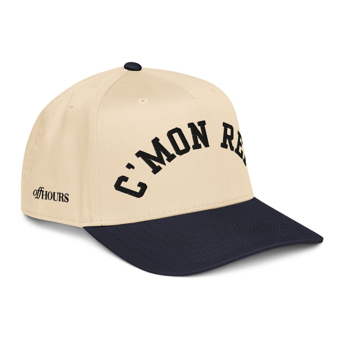 Angled view of C'MON REF! navy and natural trucker hat by Off Hours