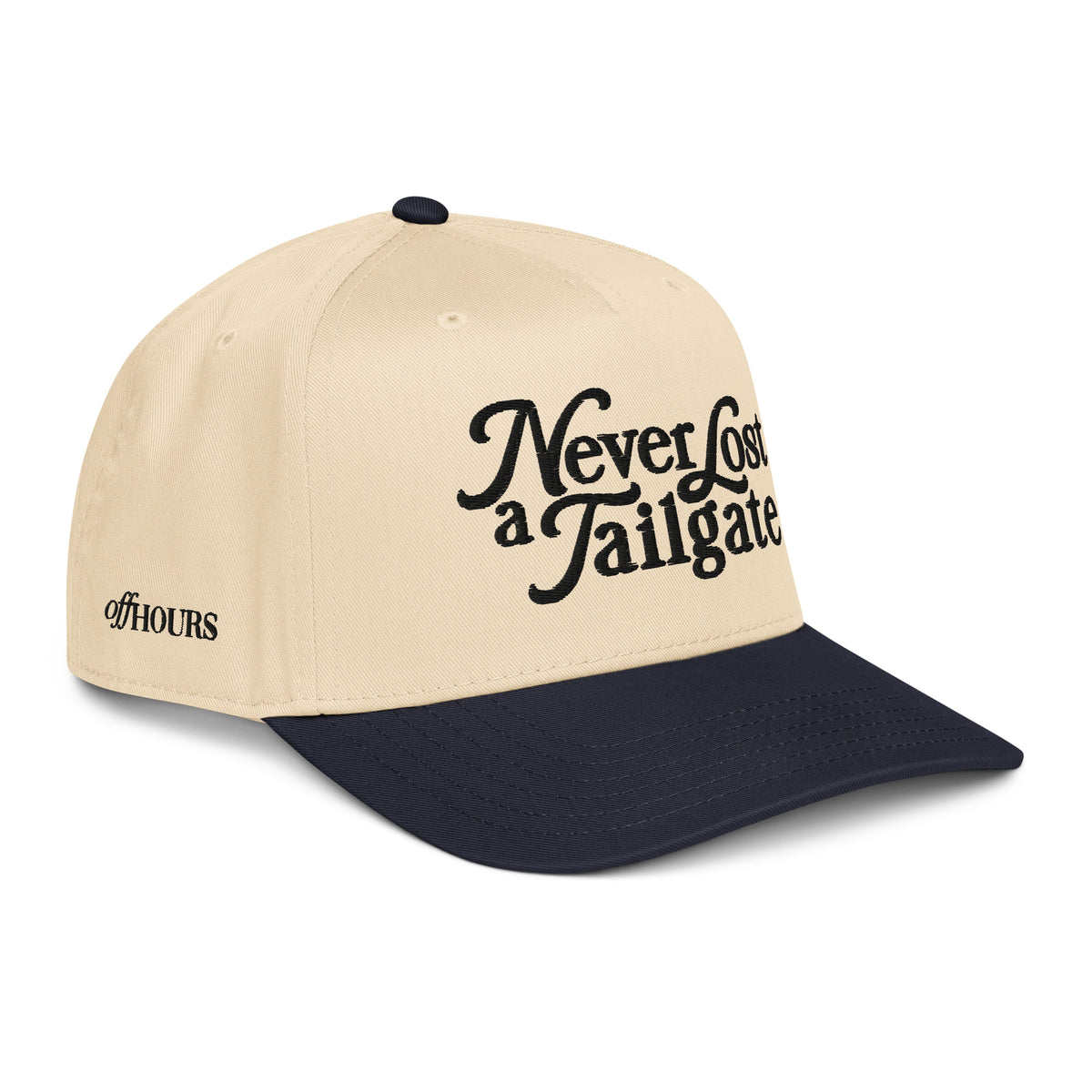 Angled view of Never Lost a Tailgate navy and natural trucker hat by Off Hours