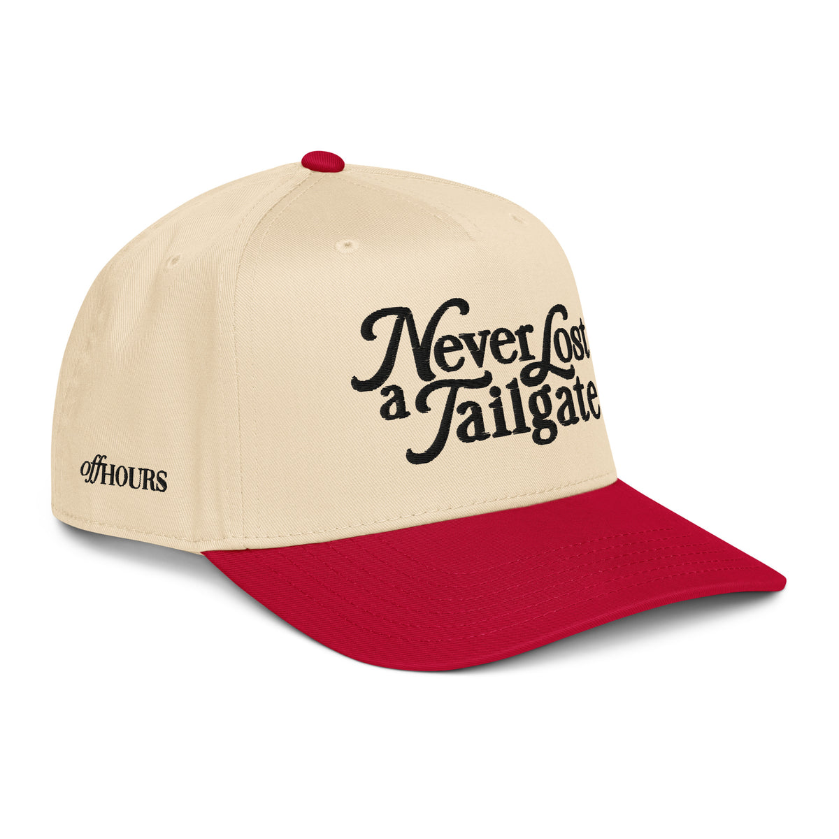 Angled view of Never Lost a Tailgate red and natural trucker hat by Off Hours