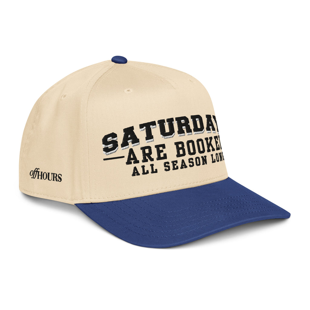 Angled view of Saturdays Are Booked blue and natural trucker hat by Off Hours