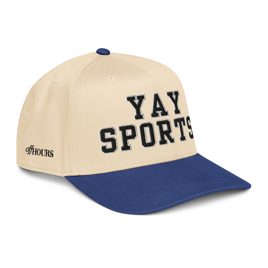 Angled view of Yay Sports blue and natural trucker hat by Off Hours