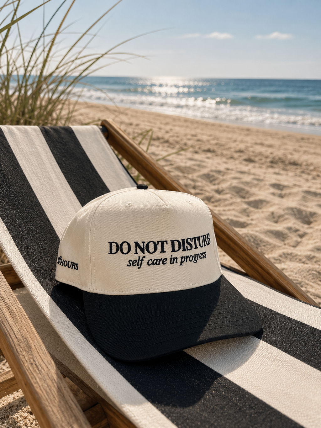 Do Not Disturb black and natural hat on beach chair